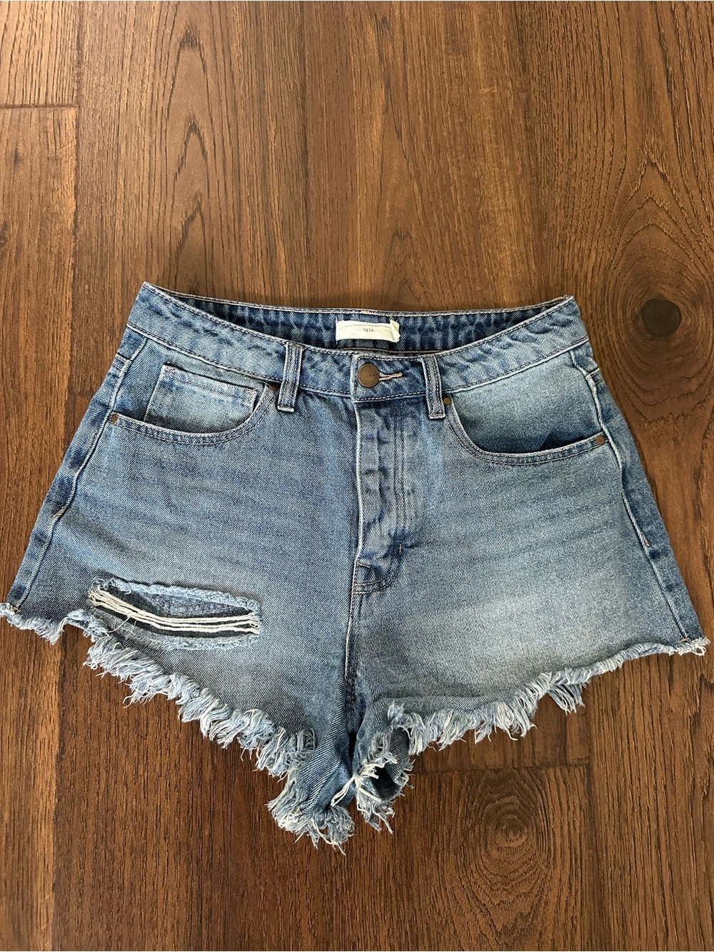 High-Rise Light Blue Distressed Denim Shorts